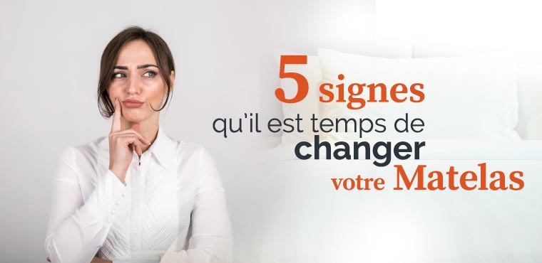 une femme s'interroge devant son lit